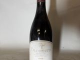 a bottle of wine that is sitting on a table