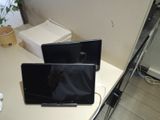 two laptops that are sitting on a table