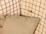 a pillow that is sitting on the back of a couch