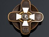 an image of a gold and white cross on a black background