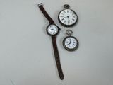 three different types of watches sitting on a table