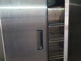 a stainless steel oven with a door open in a kitchen