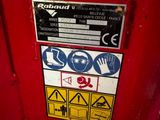 a red fire hydrant with a lot of stickers on it