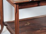 a wooden table with a glass top on a white background