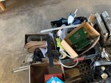 a pile of junk sitting on the floor next to a table