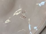 a close up of a white plate with a bird on it