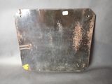 a piece of metal that has been rusted and is sitting on a table
