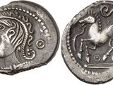 a silver coin with an image of a horse on it