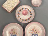 four plates and two cups on the table