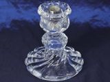 clear glass candle holder on a blue background