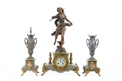 a statue of a woman standing on top of a clock