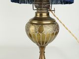 a lamp that has a blue shade on top of it