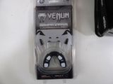 a black and white picture of a bottle opener in a package