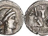 a silver coin with a woman ' s head and a man ' s head on it
