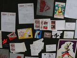 a black board with many different types of posters on it