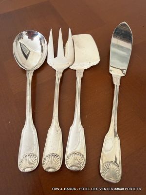 four forks and spoons sitting on a wooden table