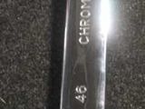 a spoon that is sitting on a black surface