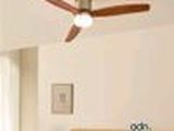 a bedroom with a bed and a ceiling fan in it