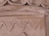 a close up of a decorative stone object with a bird on it