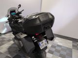 a motorcycle that is parked on a checkered floor