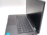 a laptop that is open on a white surface