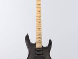 an electric guitar hanging from a string on a white background