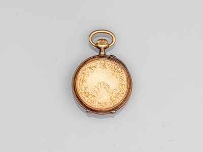 an antique pocket watch with a gold dial on a white background