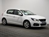 the white car is parked in a room with a checkered floor