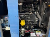an image of a blue machine with a yellow cap on top of it