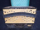 a small wooden box with holes on it
