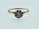 an image of a ring with a black diamond on it