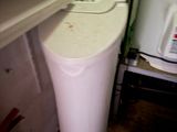 an image of a water purifier in the corner of a room