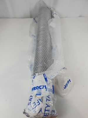 a fish that is wrapped in plastic and sitting on a table