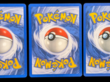 three cards with a picture of a pokemon ball on them