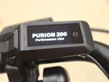 a close up of a bike with a display on the handlebar