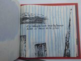 an open book with a picture of a building on it