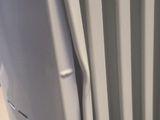a picture of a white radiator in the corner of a room