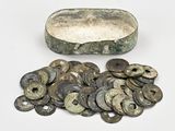 a lot of coins that are sitting on a table