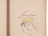 an old book with a drawing of a woman ' s face on it