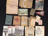 a lot of old books on a black table