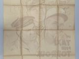 an old newspaper with a picture of a man and a woman on it