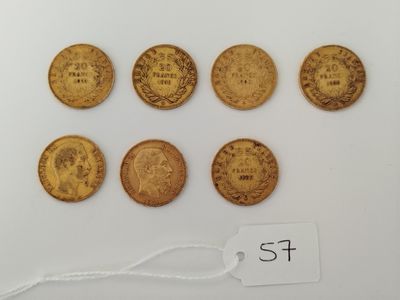 a group of five gold coins with a price tag on them