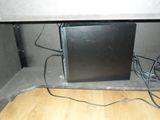 an image of a computer sitting under a desk