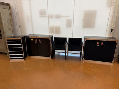 three black and silver storage cabinets in a room