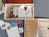 a box full of stamps and mail sitting on a table