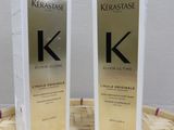 two bottles of kerastasee kerattasee hair conditioner sitting on a basket