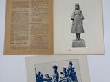 an open book with a black and white photo of a statue