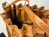 a close up of a purse with a strap on it