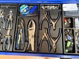 many tools in a blue box on a table