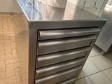 a large stainless steel counter in a commercial kitchen